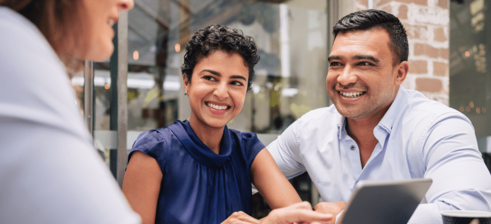 Man and women on a computer talking with a representative.