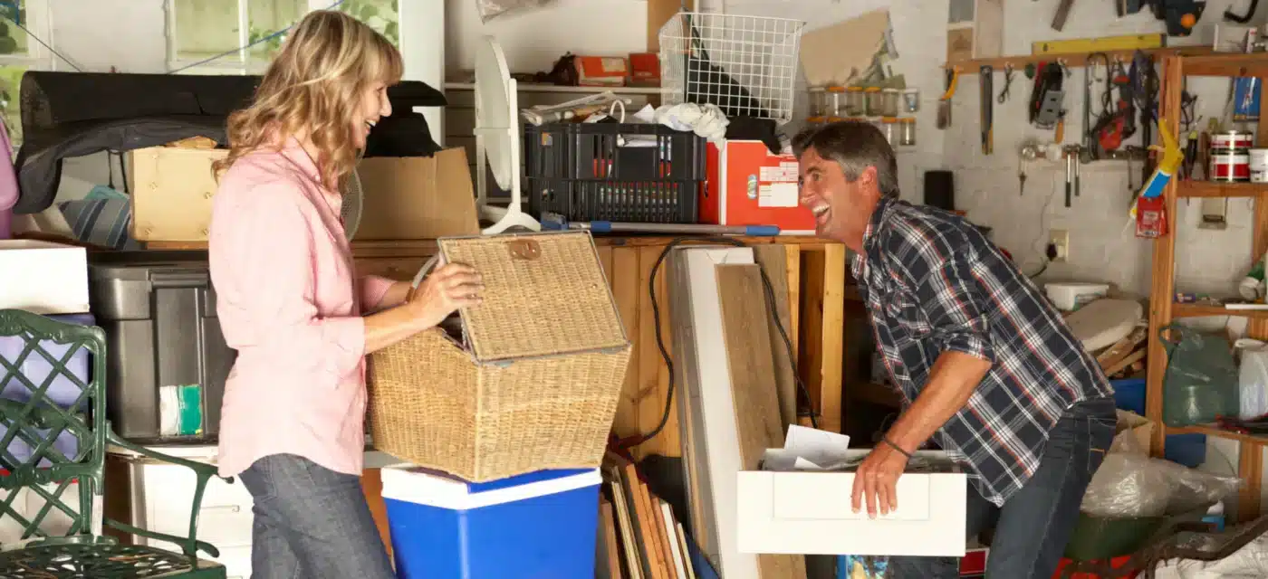 Couple cleaning out the garage