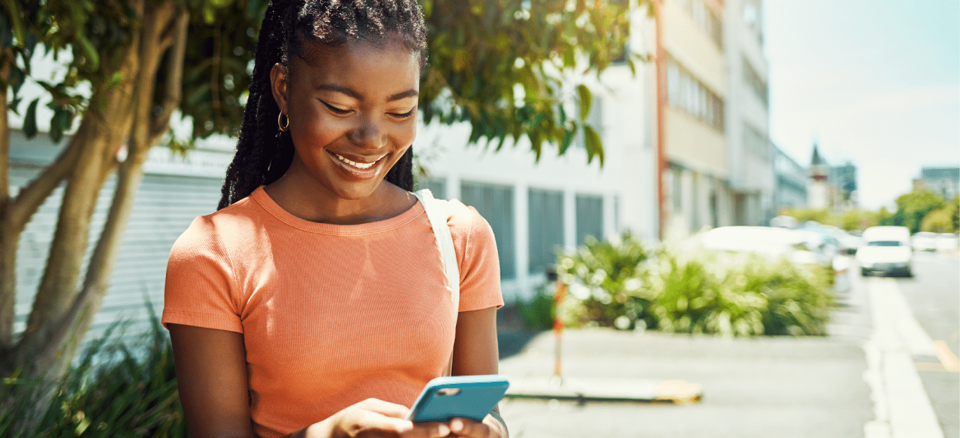 Young girl looking at her cell phone