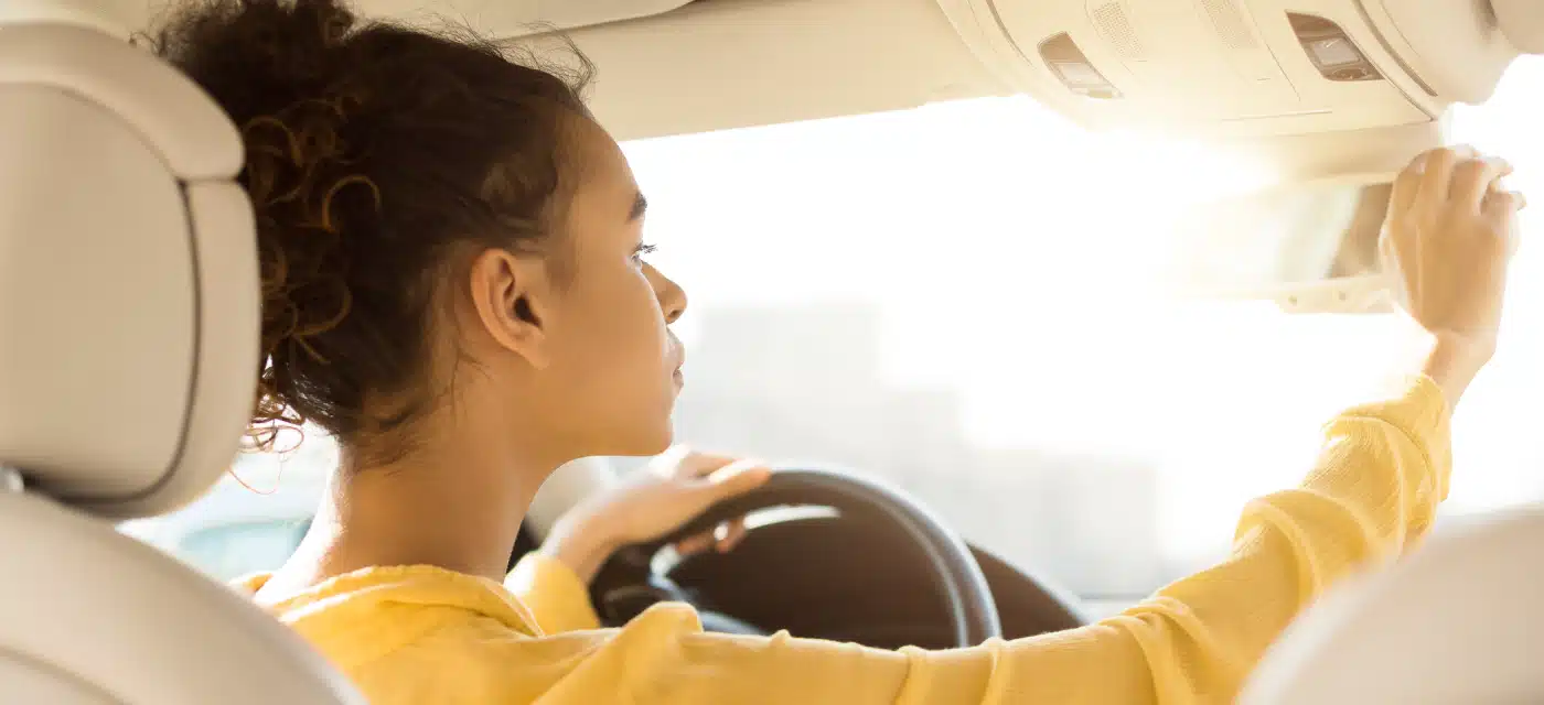 Young girl behind the driver's wheel