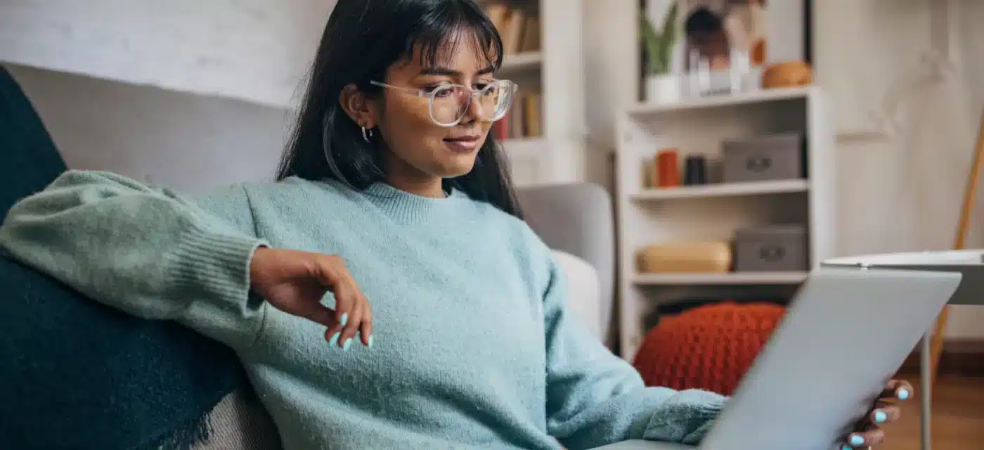 Woman sitting looking at her iPad/tablet
