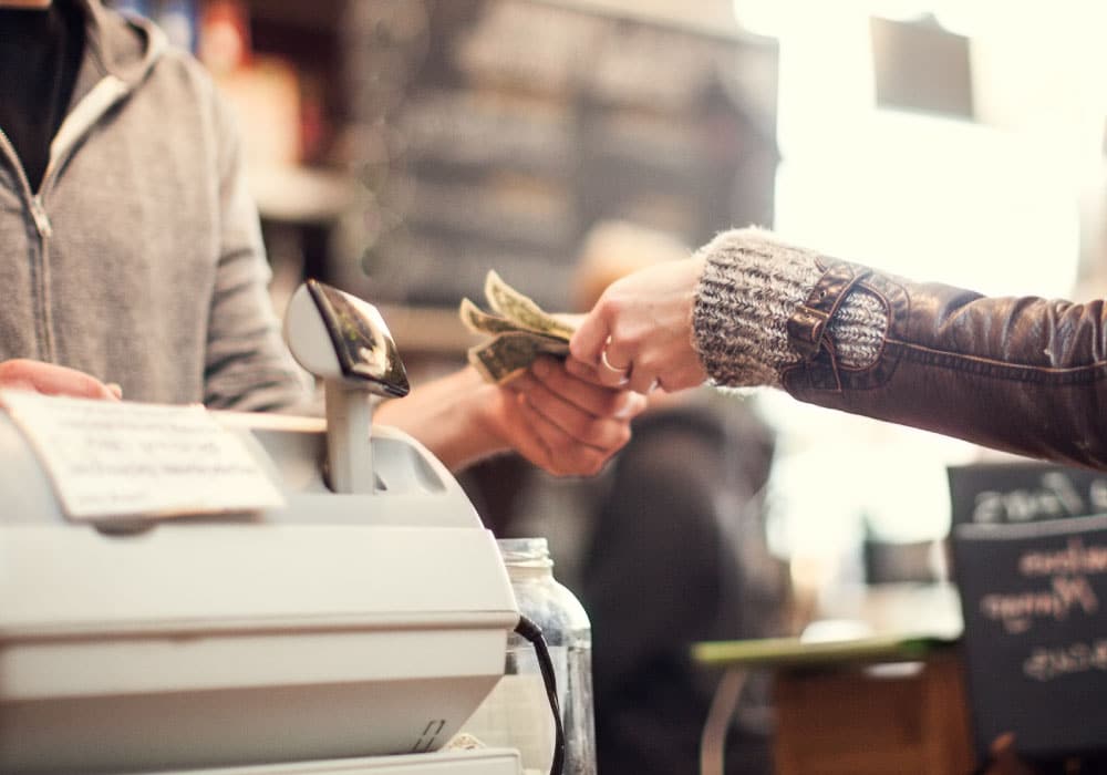 Two people exchanging money.