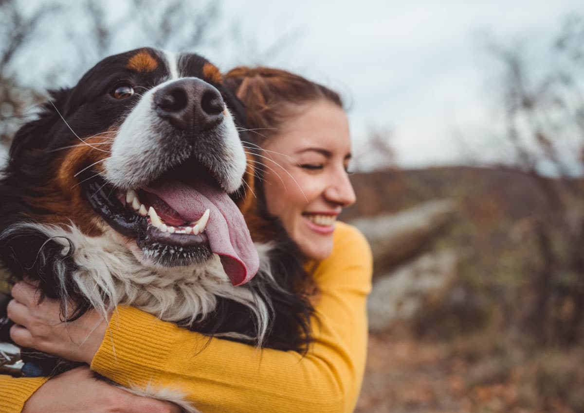 Woman hugging a dog