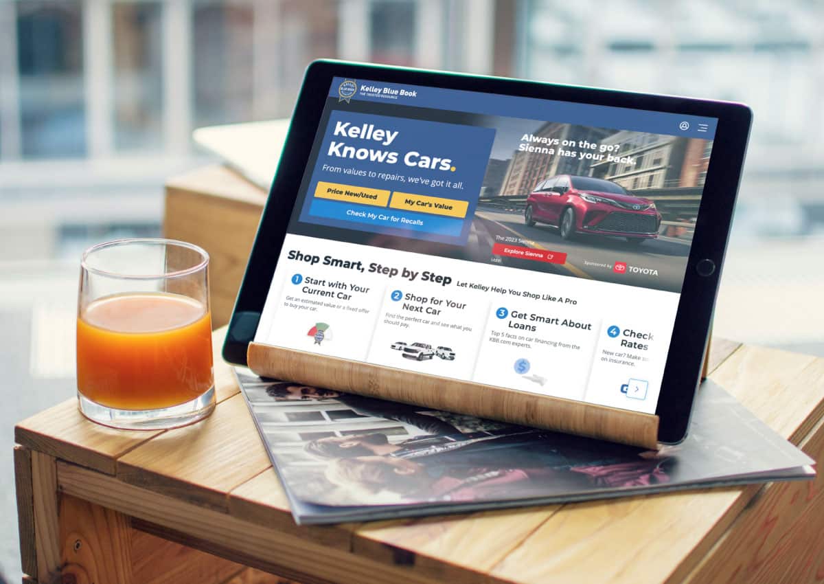 Tablet open to Kelley Blue Book research website