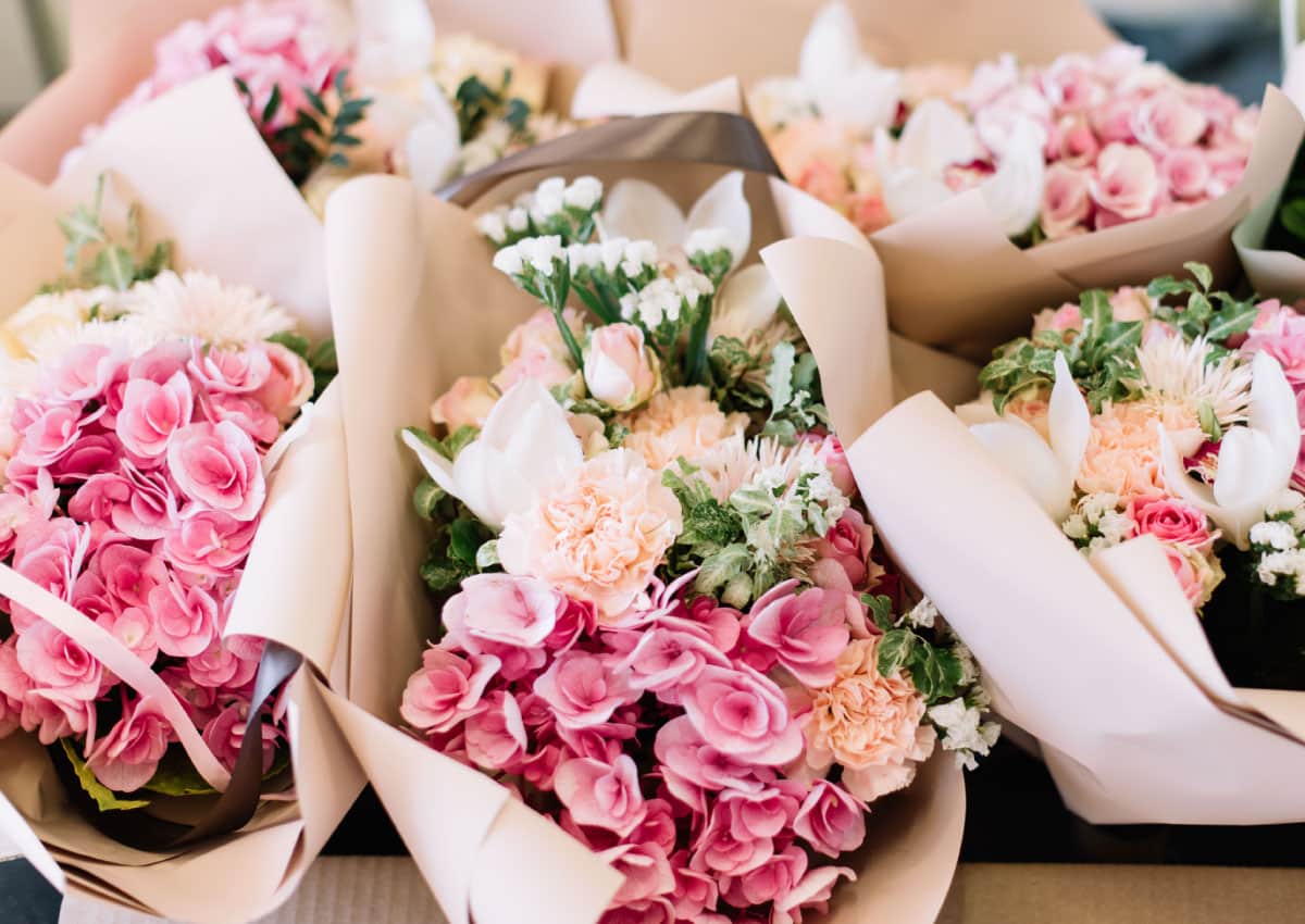 Various flower bouquets in shades of pink and white