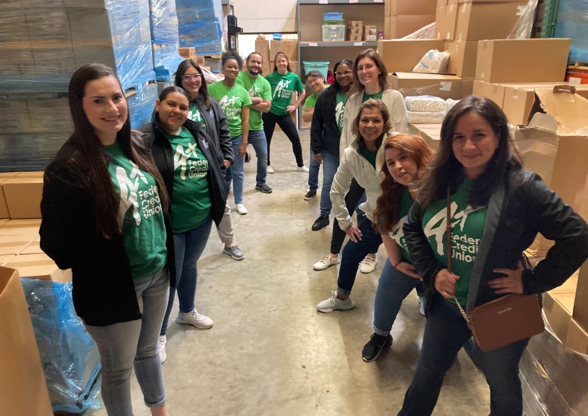 A+FCU volunteers pose in Austin Diaper Bank warehouse