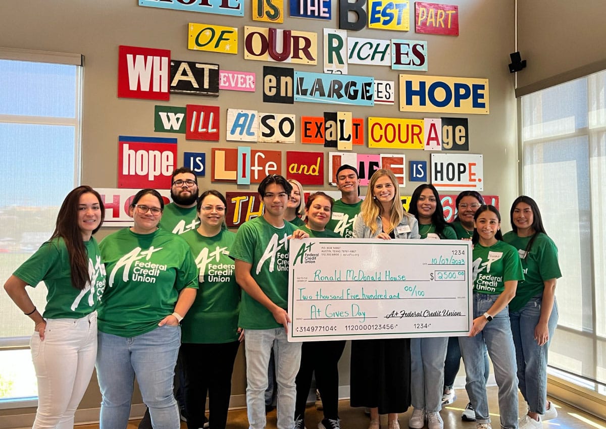 Team A+ presents a $2,500 check to the Ronald McDonald House Charities of Central Texas for receiving top number of votes in the A+ Gives Day Community Voting.