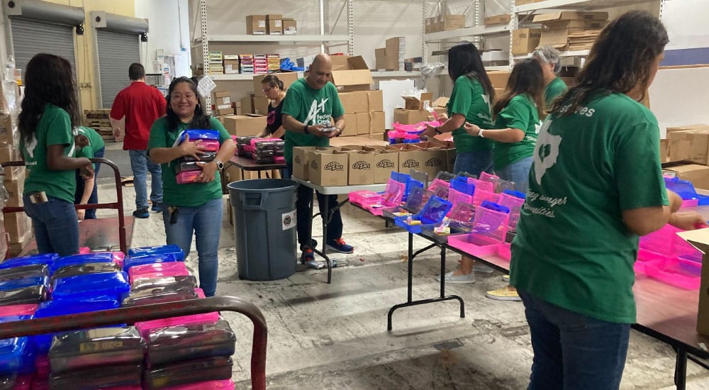 A+ volunteers to put together school supplies and backpacks for Austin ISD students