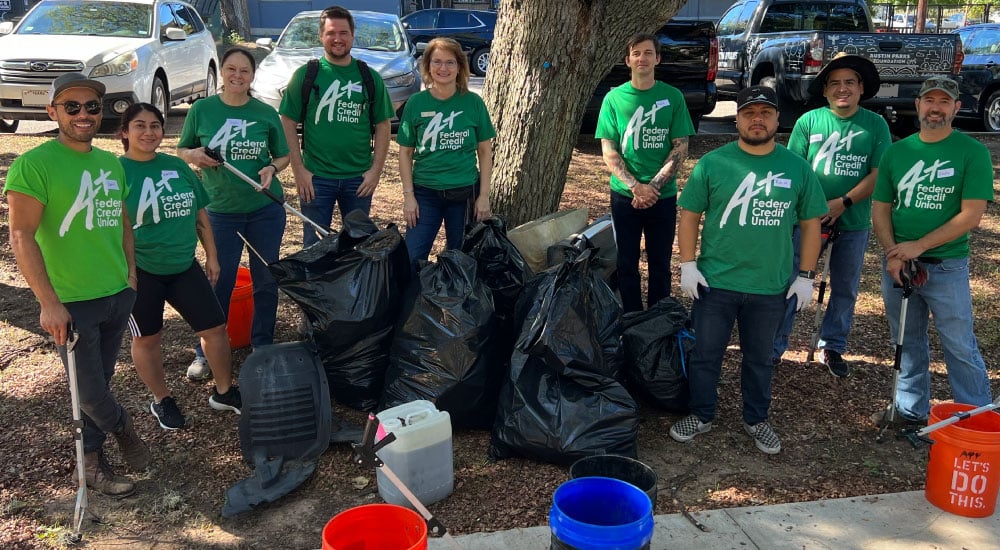 Team A+ collects trash on walking paths with Austin Parks Foundation