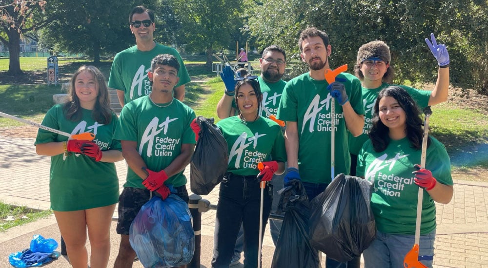 Team A+ poses after collecting trash on walking paths with Keep Austin Beautiful