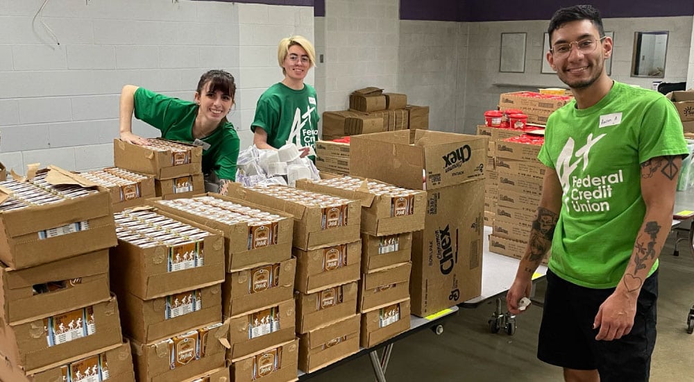 Team A+ packs bags of food for School Fuel in San Marcos, Texas.