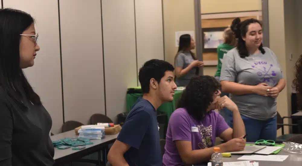 Campers listen to instructions during Mad City Money